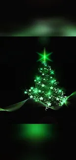 Glowing green Christmas tree with stars and ornaments on dark background.