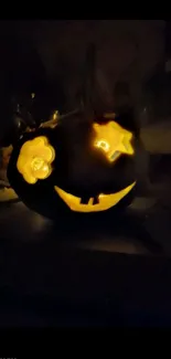 Glowing carved pumpkin with star and flower eyes for Halloween wallpaper.