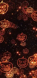 Glowing Halloween pumpkin wallpaper with a dark, starry background.