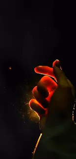 A hand glowing in a dark background, emitting mystical light.