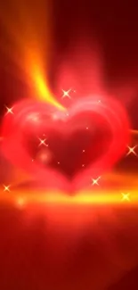 Glowing red heart with vibrant colors and sparkles on a mobile wallpaper.