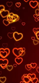 Mobile wallpaper with glowing heart bokeh effect in red and orange hues.