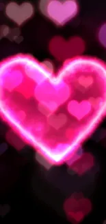 Glowing hot pink heart wallpaper with dark background.