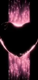 Glowing pink heart-shaped design on dark background.