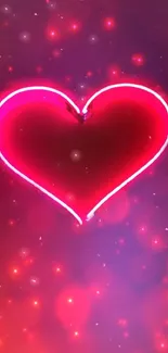 Glowing pink neon heart on dark background.