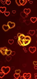 Mobile wallpaper with glowing red and yellow hearts on a dark red background.