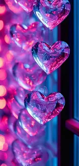 Rows of glowing heart ornaments with vibrant colors by a window.