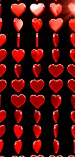 Vertical rows of vibrant red hearts glowing on a dark background.