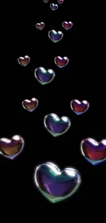 Colorful glowing hearts on a black background wallpaper.