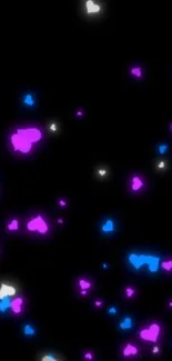 Vibrant glowing hearts on a dark background wallpaper.