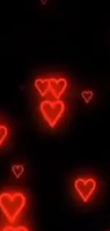 Glowing red hearts on black background wallpaper.