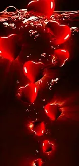 Glowing red hearts submerged underwater, creating a romantic visual.