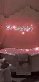 Bathroom with pink glow and 'Be anything' neon sign on hexagonal tiles.