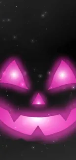 Pink glowing Jack-O'-Lantern on a black background with stars.