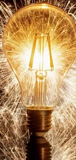 Lightbulb with sparks emitting vibrant amber glow.