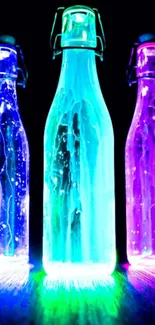 Three neon bottles glowing in teal, blue, and purple hues on a dark background.