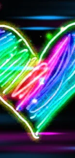 Colorful neon heart on a black background, glowing brightly.