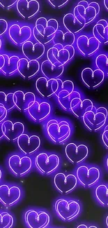 Purple neon heart pattern on dark background.