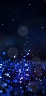 Mobile wallpaper with dark blue glowing bokeh effect.