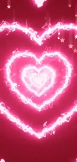 Vibrant pink wallpaper with glowing hearts and stars.