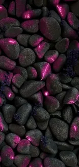 Dark stones with glowing pink highlights wallpaper.