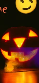 Glowing jack-o'-lantern with emojis on a Halloween themed wallpaper.