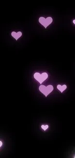 Glowing purple hearts on a black background.