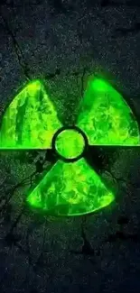 Glowing green radiation symbol on dark background.