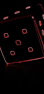 A glowing red dice on a sleek black background.