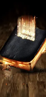 Glowing Bible with gold sparks on wooden background.