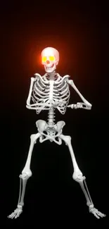 Skeleton with glowing orange eyes on a dark background.