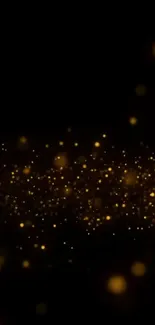 Glowing golden sparkles on a dark background wallpaper.