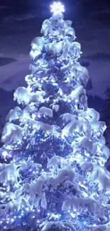 Illuminated Christmas tree with snowy branches under a starry night sky.