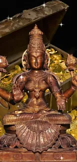 Goddess Lakshmi statue with treasure chest and gold coins.