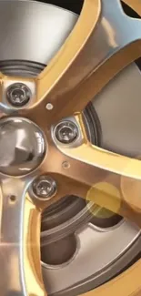 Close-up of a gold and chrome wheel with a luxurious finish.