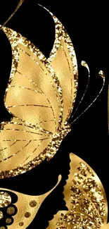 Gold butterfly wallpaper with dark background and glitter details.