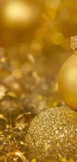 Festive gold ornament with bokeh lights.