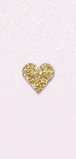 Gold glitter heart on light pink background wallpaper.