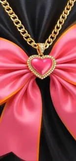 Gold chain with pink bow and heart pendant.