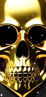 Gold skull with shiny finish on dark background.