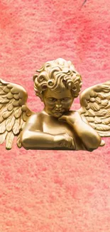 Golden angel statue with wings on a pink textured background.