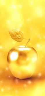 Golden apple with leaf on glowing background.