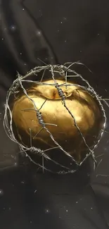 Golden apple wrapped in barbed wire on a dark background.