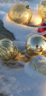 Glistening gold ornaments on a sandy beach with ocean waves.