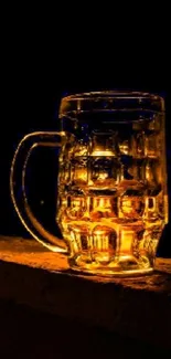 Golden beer mug illuminated in the dark, perfect for mobile wallpaper.