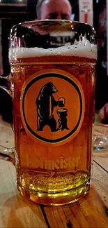 Golden beer mug on a rustic table in a cozy pub setting.