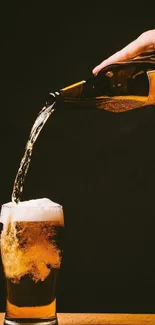 Golden beer poured into a glass with foam, set against a dark background.