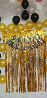 Gold and black balloons birthday celebration on mobile wallpaper.