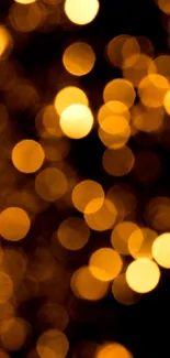 Golden bokeh lights background with warm glow suitable for wallpaper.