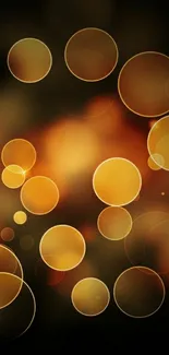 Golden bokeh mobile wallpaper with warm glowing circles on dark background.